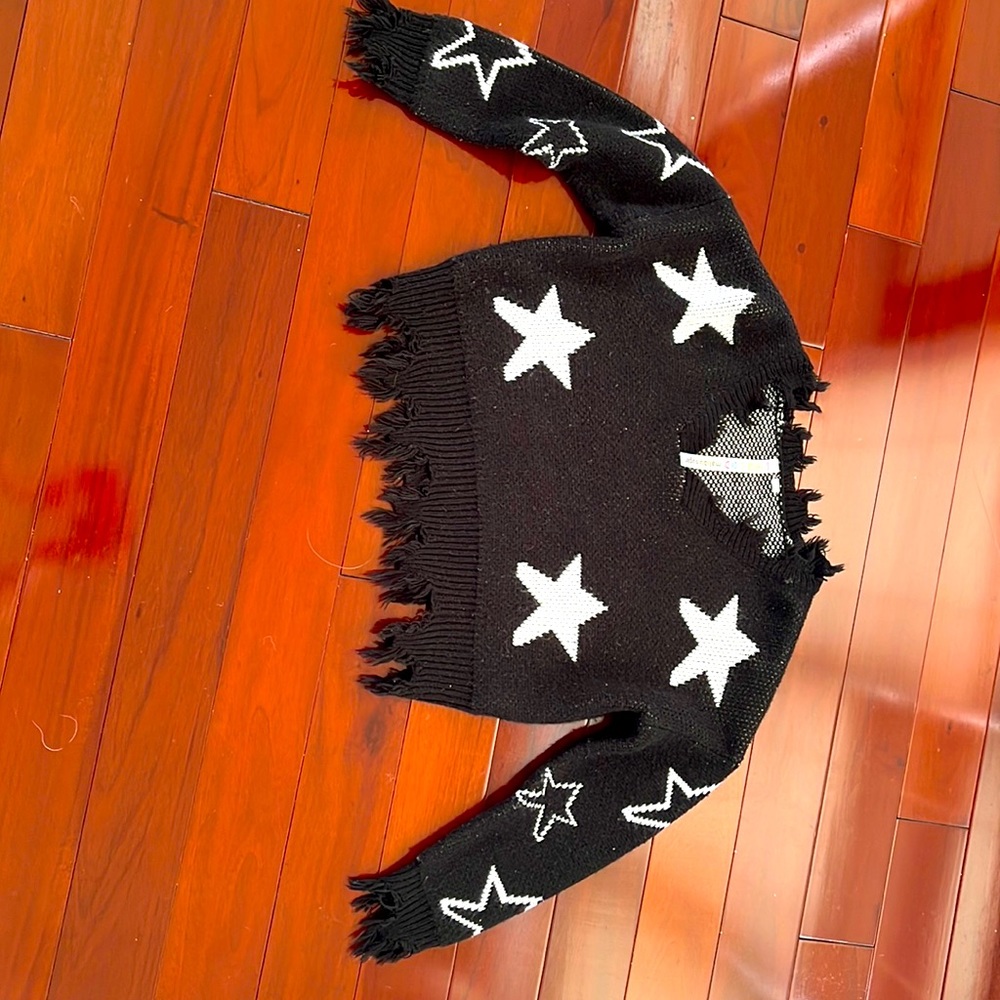 -Malibu sugar, black and white star sweater, size small